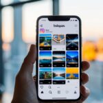 Um smartphone exibindo o aplicativo Instagram com uma série de miniaturas de vídeo visíveis na tela